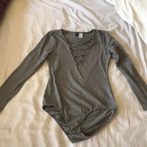 Long sleeved gray bodysuit